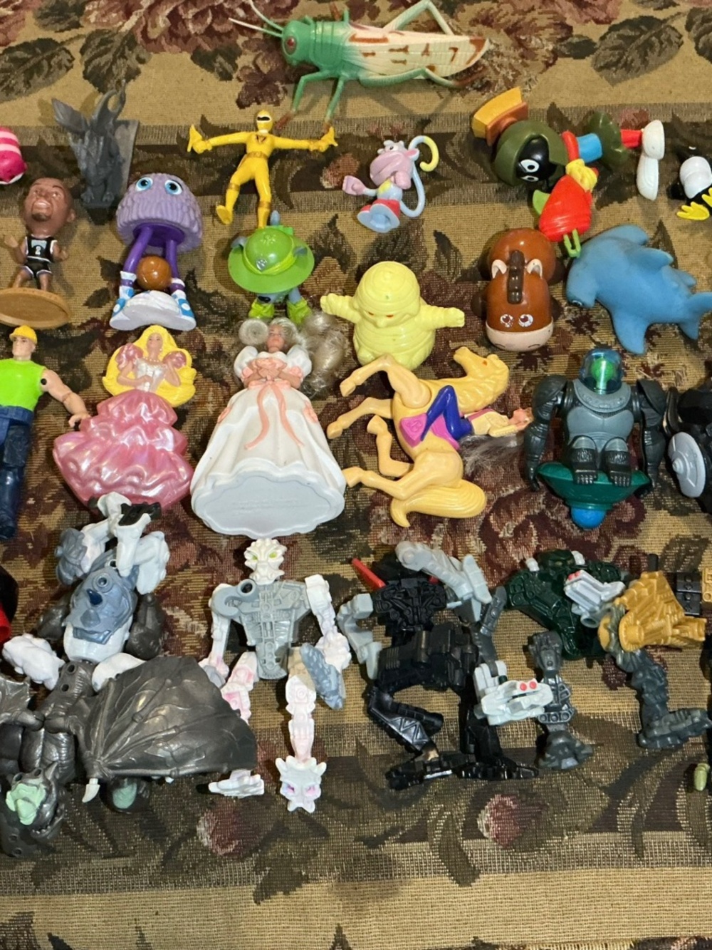 32 Miscellaneous small Toy lot with NBA Bionicle looney tune barbie and more